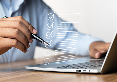 Professional working late at a laptop in a city office