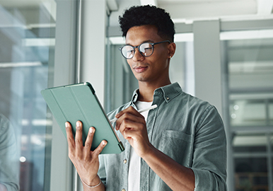 TTC streetcar with the CN Tower in the background, downtown Toronto